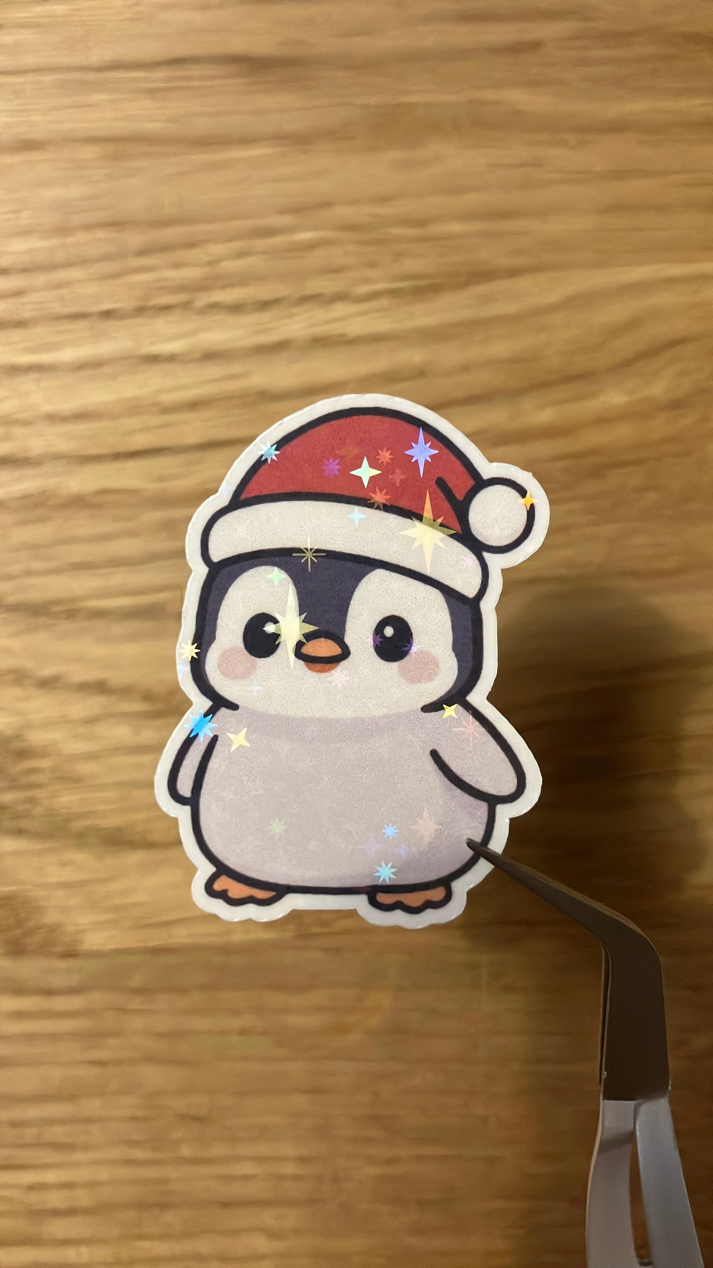 Baby Pinguin mit Weihnachtsmütze Sticker