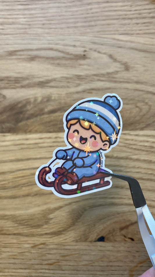 Junge mit Schlitten Sticker